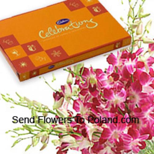 Boeket roze orchideeën met assortiment chocolaatjes